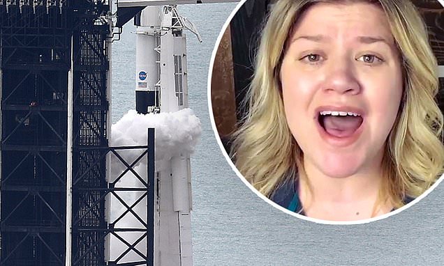 Science Tips  Tips  Tricks   Technology Kelly Clarkson sings the national anthem prior to what was to be the NASA-Space X collaboration